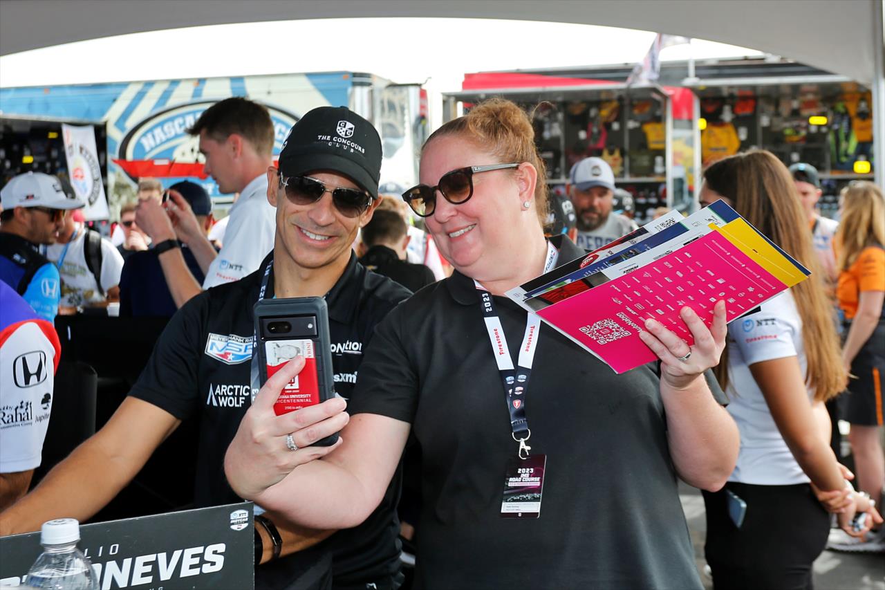 Helio Castroneves with a fan - Gallagher Grand Prix - By: Paul Hurley -- Photo by: Paul Hurley